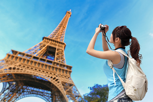 Happy travel woman in Paris